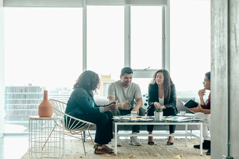 Team brainstorm meeting in modern office