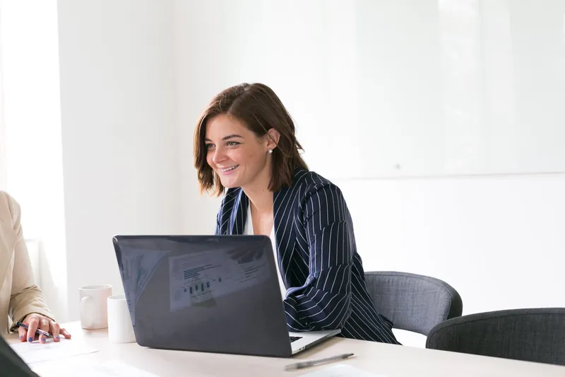 Woman smiling with laptop